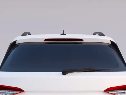 The rear window and wiper of a white hatchback