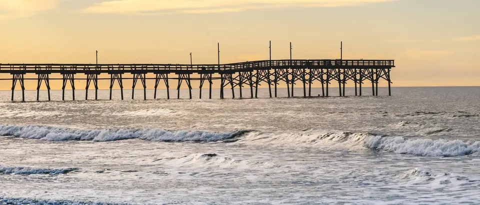 The fishing pier at Sunset Beach, NC, a few miles from Carolina Shores, in the evening light
