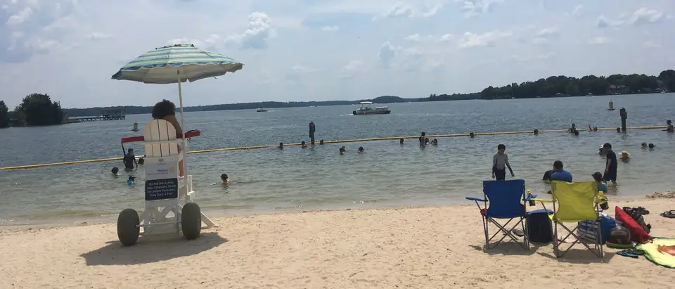 The sandy beach on Lake Norman at Ramsey Creek Park in Cornelius, NC, on a summer day