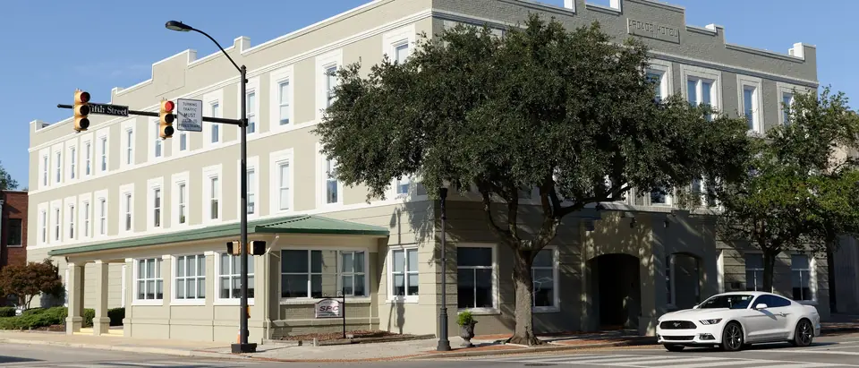 The historic Arcade Hotel on a sunny downtown corner in Hartsville, SC
