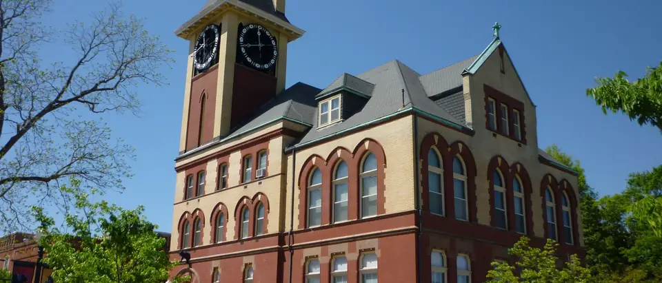 The red-brick New Bern City Hall with its clock tower on a sunny day in New Bern, NC