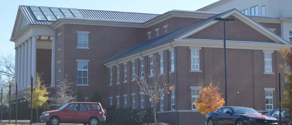 The red-brick Chatham County Courthouse building with white columns in Pittsboro, NC