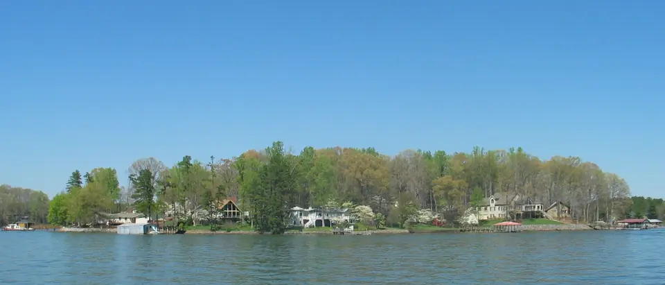 Lakefront homes among green trees on Lake Norman, NC, the lake along Sherrills Ford