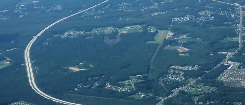 Highway 31 curving through the woods and neighbourhoods of Socastee, SC, seen from the air