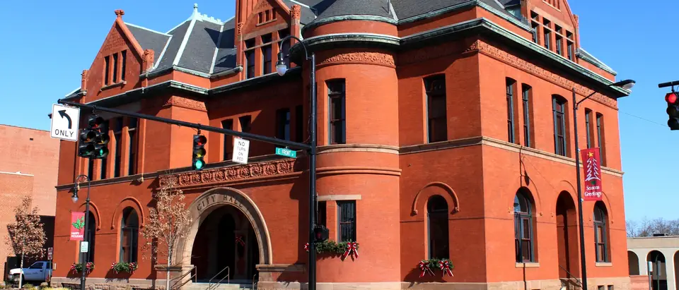 The red-brick Romanesque City Hall on a sunny corner in downtown Statesville, NC