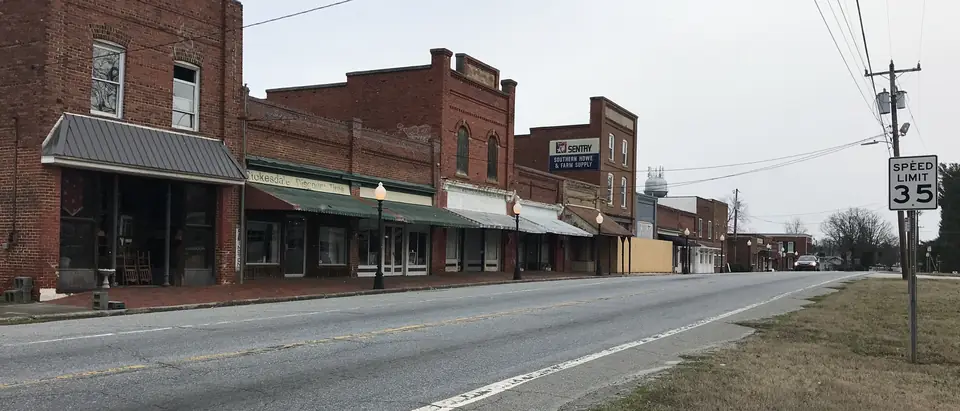 The row of historic brick storefronts along Main Street in Stokesdale, NC