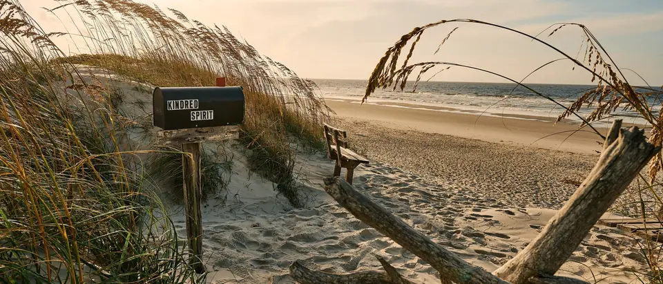 The Kindred Spirit mailbox among sea oats on the dunes of Bird Island at Sunset Beach, NC