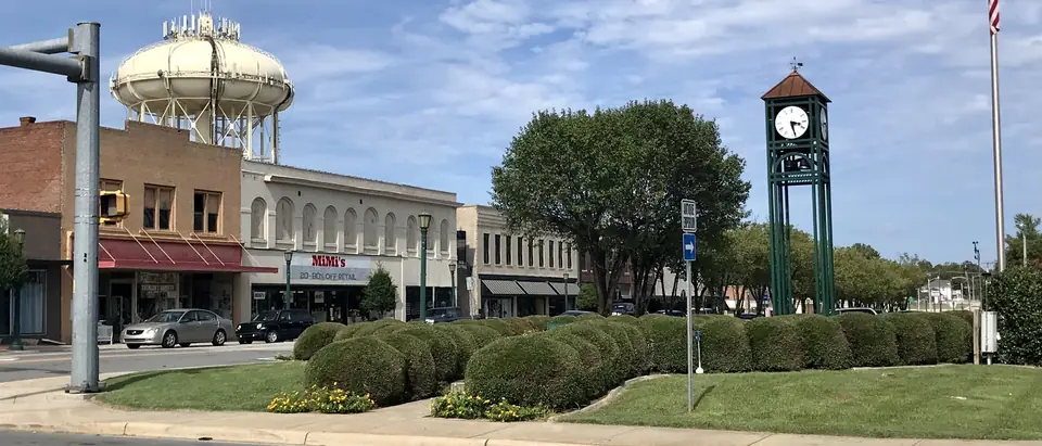 Downtown Thomasville, NC, with its clock tower, water tower and brick storefronts under a blue sky