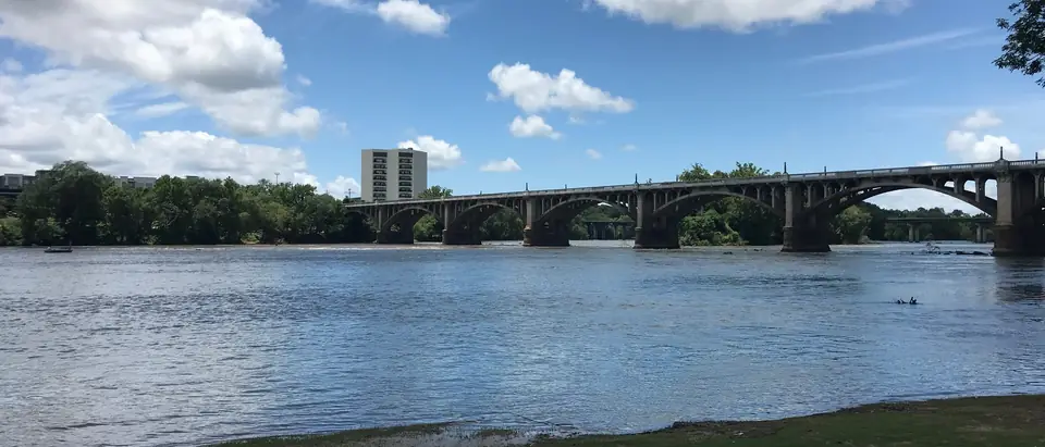 The Congaree River and the Gervais Street Bridge seen from the shore in West Columbia, SC